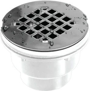 Close-up of a shiny, circular metal drain cover with diamond-shaped holes and water droplets on the surface, conveying a sense of cleanliness and freshness.