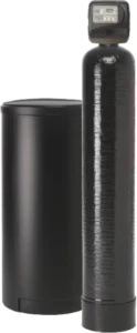 Tall black water softener tank with a digital control head, next to a shorter, cylindrical black salt container. Modern, sleek design.