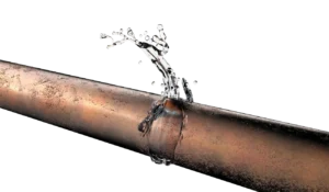 Copper pipe with a noticeable crack, spurting water in a dynamic arch against a black background, illustrating plumbing issues and urgency.