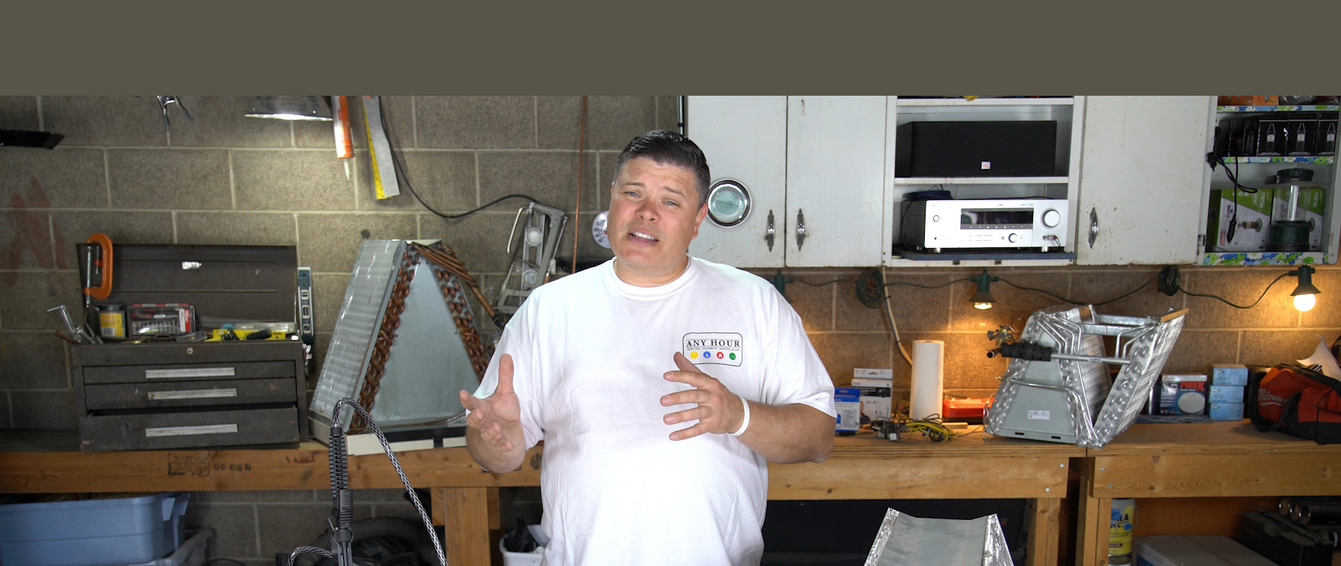 Man standing in workshop, explaining something to the camera. Indicates projects and DIY.